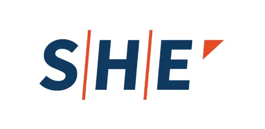 Logo featuring the word 'SHE' in bold blue letters, with a stylized red accent on the letter 'E.'