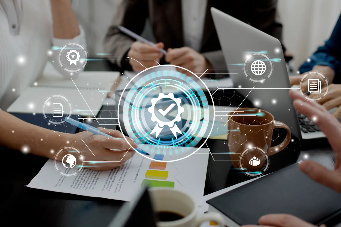 A group meeting with hands on documents and a laptop, featuring digital icons representing quality assurance and collaboration.